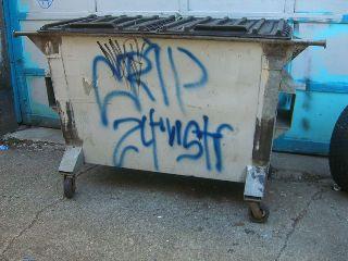 dumpster tagged by the 24th Street Crips (wikimedia.org)