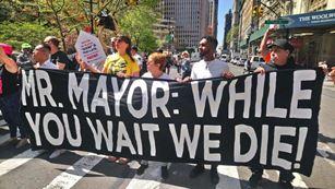 NYC protesters demand Mayor De Blasio move on a long-delayed safe injection site report. (Drug Policy Alliance)